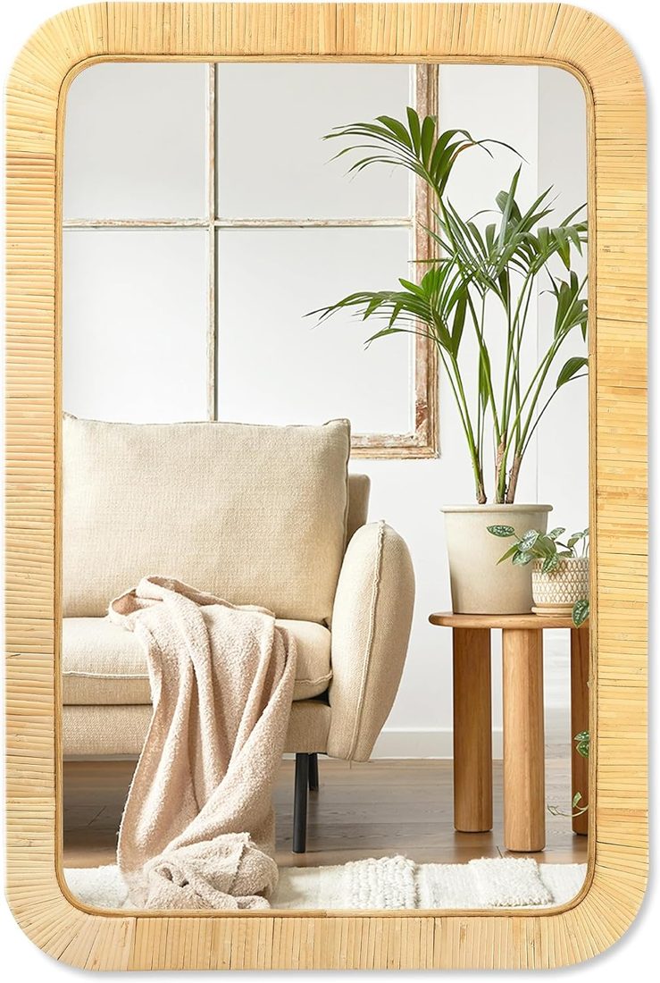 Rectangle rattan wall mirror with a woven frame above a shelf